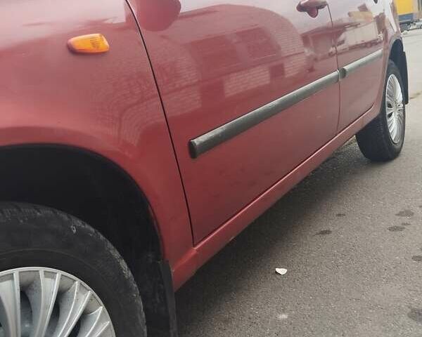 Красный ВАЗ 1117 Калина, объемом двигателя 1.39 л и пробегом 205 тыс. км за 2700 $, фото 9 на Automoto.ua