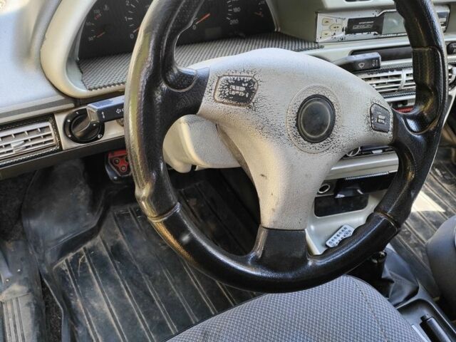 Красный ВАЗ 21099, объемом двигателя 1 л и пробегом 275 тыс. км за 1550 $, фото 6 на Automoto.ua