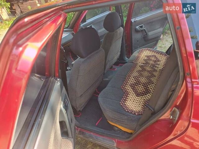 Красный ВАЗ 2111, объемом двигателя 1.5 л и пробегом 397 тыс. км за 1500 $, фото 1 на Automoto.ua