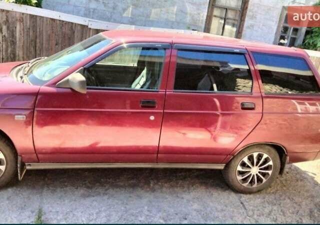 Красный ВАЗ 2111, объемом двигателя 1.5 л и пробегом 255 тыс. км за 2400 $, фото 1 на Automoto.ua