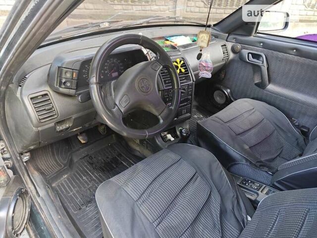 Зеленый ВАЗ 2111, объемом двигателя 1.5 л и пробегом 420 тыс. км за 1200 $, фото 4 на Automoto.ua