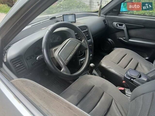 Серый ВАЗ 2112, объемом двигателя 1.6 л и пробегом 210 тыс. км за 2000 $, фото 2 на Automoto.ua