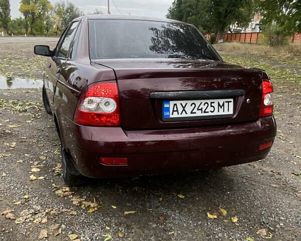 Красный ВАЗ 2170 Priora, объемом двигателя 1.6 л и пробегом 185 тыс. км за 2050 $, фото 1 на Automoto.ua