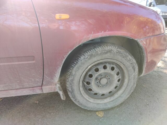 Красный ВАЗ Калина, объемом двигателя 1.4 л и пробегом 196 тыс. км за 1250 $, фото 4 на Automoto.ua