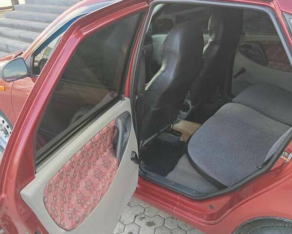 Красный ВАЗ Калина, объемом двигателя 1.39 л и пробегом 117 тыс. км за 2800 $, фото 7 на Automoto.ua