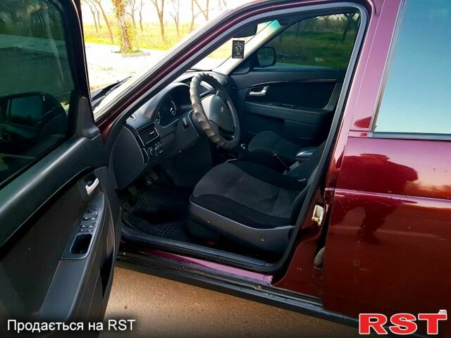 Красный ВАЗ Priora, объемом двигателя 1.6 л и пробегом 118 тыс. км за 3900 $, фото 9 на Automoto.ua