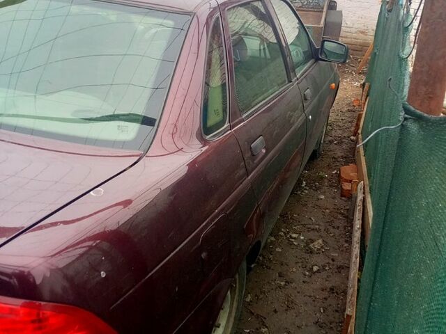 Красный ВАЗ Priora, объемом двигателя 1.6 л и пробегом 190 тыс. км за 4000 $, фото 2 на Automoto.ua