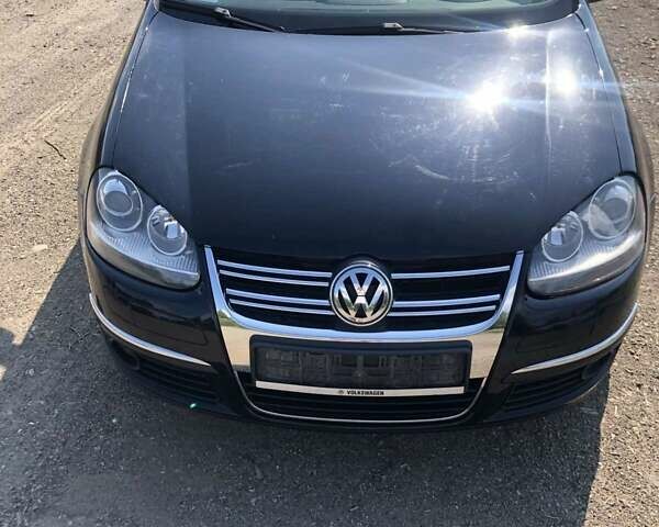 Чорний Фольксваген Джетта, об'ємом двигуна 1.39 л та пробігом 157 тис. км за 5300 $, фото 4 на Automoto.ua