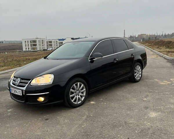 Черный Фольксваген Джетта, объемом двигателя 1.4 л и пробегом 216 тыс. км за 7500 $, фото 28 на Automoto.ua