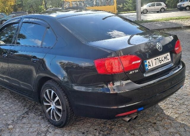 Чорний Фольксваген Джетта, об'ємом двигуна 2 л та пробігом 265 тис. км за 7200 $, фото 3 на Automoto.ua