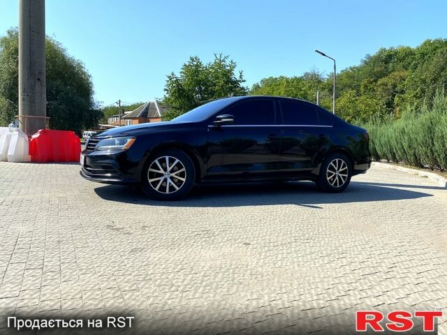 Черный Фольксваген Джетта, объемом двигателя 1.4 л и пробегом 143 тыс. км за 10900 $, фото 1 на Automoto.ua