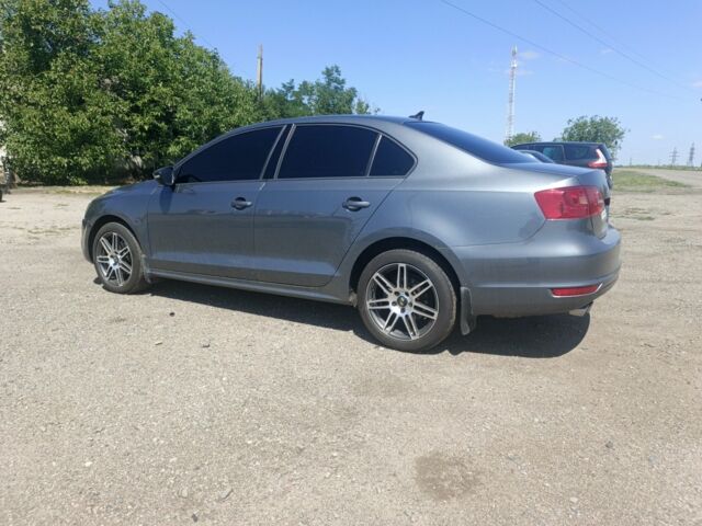 Серый Фольксваген Джетта, объемом двигателя 1.4 л и пробегом 84 тыс. км за 11500 $, фото 1 на Automoto.ua