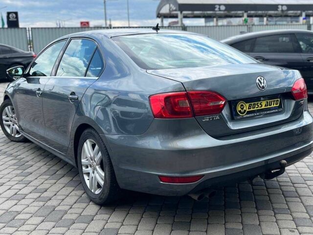 Серый Фольксваген Джетта, объемом двигателя 1.4 л и пробегом 290 тыс. км за 8990 $, фото 4 на Automoto.ua