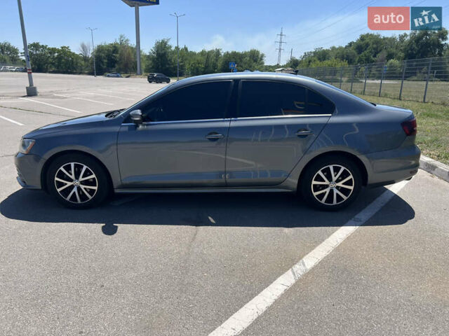 Серый Фольксваген Джетта, объемом двигателя 1.4 л и пробегом 172 тыс. км за 11500 $, фото 3 на Automoto.ua