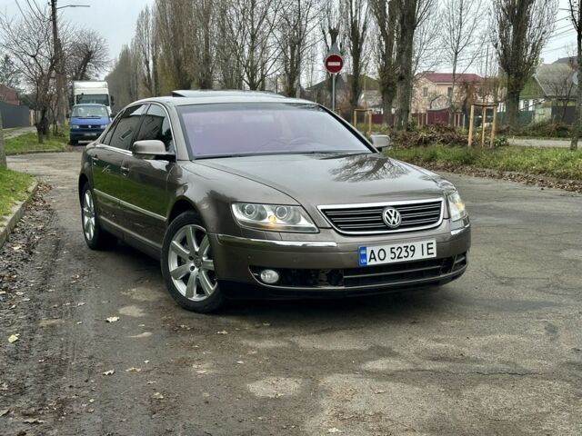 Коричневый Фольксваген Фаетон, объемом двигателя 4.2 л и пробегом 234 тыс. км за 5200 $, фото 1 на Automoto.ua