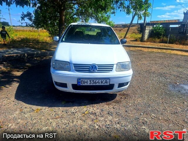 Белый Фольксваген Поло, объемом двигателя 1.4 л и пробегом 190 тыс. км за 1999 $, фото 1 на Automoto.ua