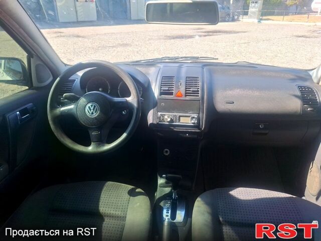 Белый Фольксваген Поло, объемом двигателя 1.4 л и пробегом 190 тыс. км за 1999 $, фото 4 на Automoto.ua