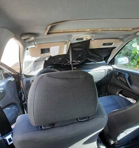 Чорний Фольксваген Поло, об'ємом двигуна 1.4 л та пробігом 312 тис. км за 2000 $, фото 4 на Automoto.ua