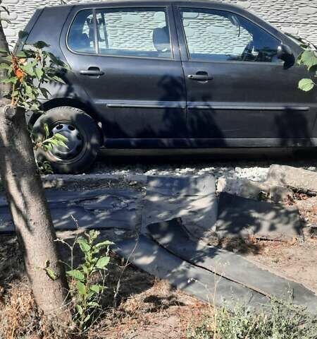 Чорний Фольксваген Поло, об'ємом двигуна 1.4 л та пробігом 312 тис. км за 2000 $, фото 2 на Automoto.ua