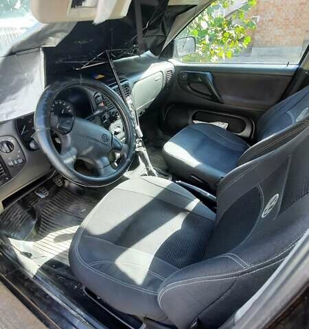 Чорний Фольксваген Поло, об'ємом двигуна 1.4 л та пробігом 312 тис. км за 2000 $, фото 5 на Automoto.ua