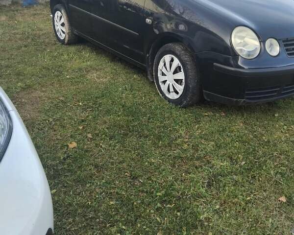 Черный Фольксваген Поло, объемом двигателя 1.4 л и пробегом 160 тыс. км за 4750 $, фото 14 на Automoto.ua