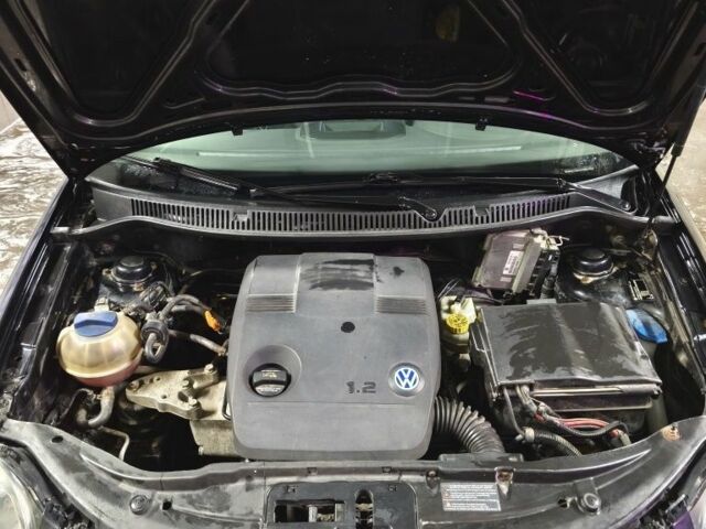 Черный Фольксваген Поло, объемом двигателя 1.2 л и пробегом 219 тыс. км за 3950 $, фото 5 на Automoto.ua