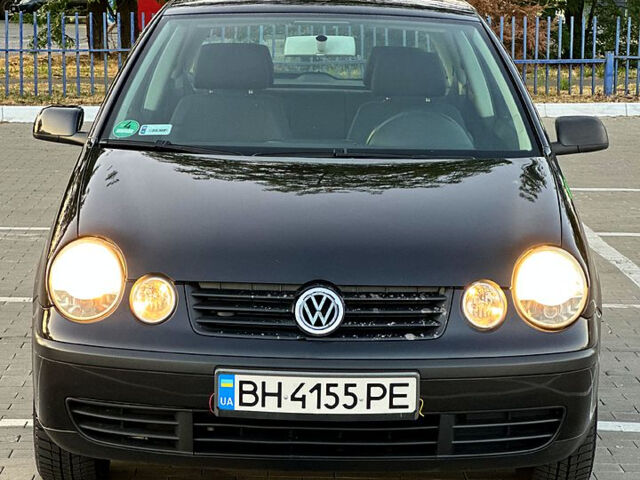 Черный Фольксваген Поло, объемом двигателя 1.2 л и пробегом 192 тыс. км за 3300 $, фото 4 на Automoto.ua