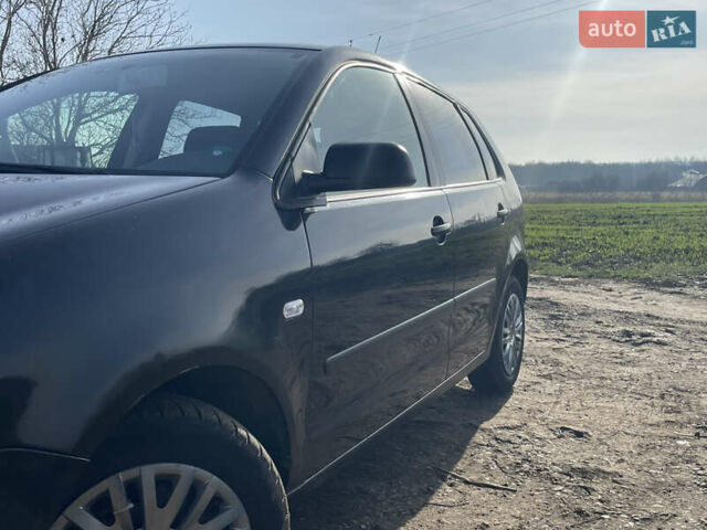 Чорний Фольксваген Поло, об'ємом двигуна 1.2 л та пробігом 242 тис. км за 2999 $, фото 1 на Automoto.ua