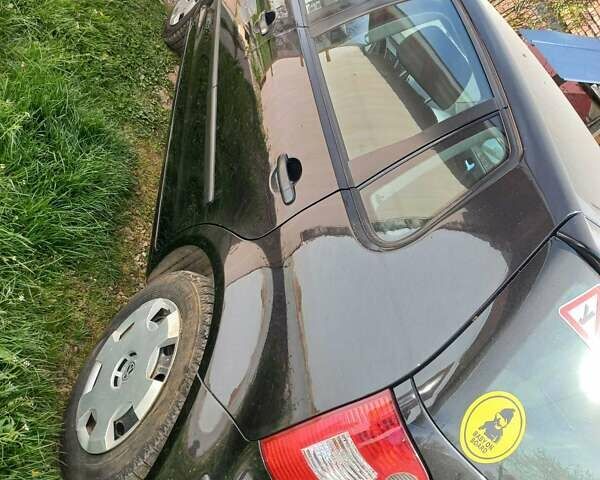 Черный Фольксваген Поло, объемом двигателя 1.4 л и пробегом 125 тыс. км за 5650 $, фото 1 на Automoto.ua