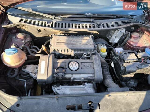 Червоний Фольксваген Поло, об'ємом двигуна 1.39 л та пробігом 339 тис. км за 3850 $, фото 13 на Automoto.ua