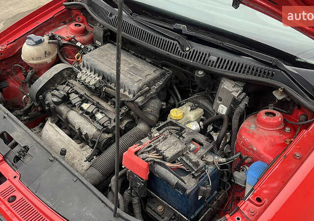 Красный Фольксваген Поло, объемом двигателя 1.4 л и пробегом 200 тыс. км за 4500 $, фото 23 на Automoto.ua