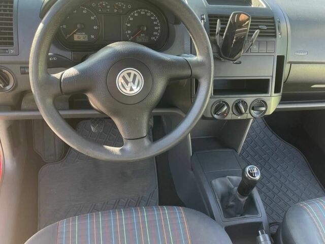 Красный Фольксваген Поло, объемом двигателя 1.2 л и пробегом 168 тыс. км за 4500 $, фото 1 на Automoto.ua