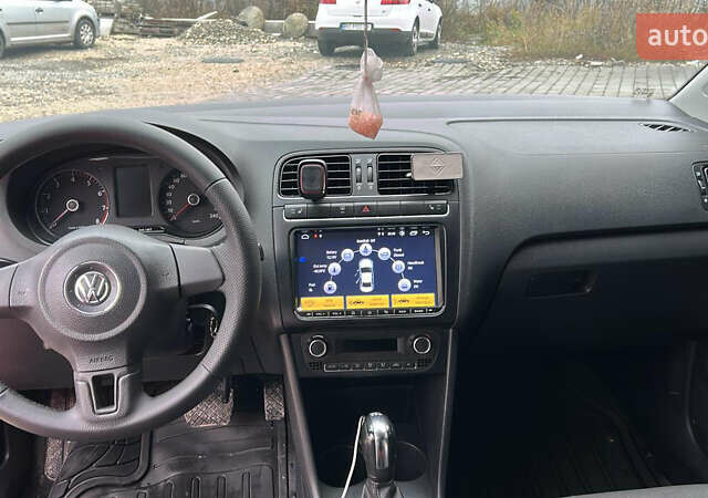 Червоний Фольксваген Поло, об'ємом двигуна 1.39 л та пробігом 180 тис. км за 7850 $, фото 8 на Automoto.ua