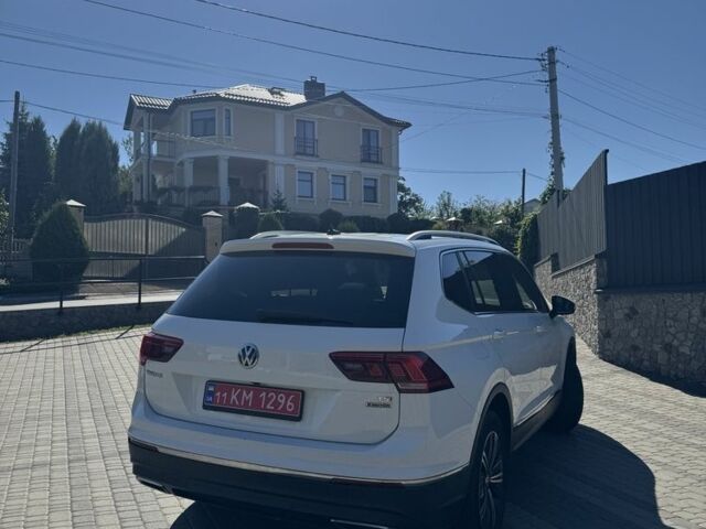 Білий Фольксваген Тігуан, об'ємом двигуна 2 л та пробігом 151 тис. км за 23000 $, фото 3 на Automoto.ua