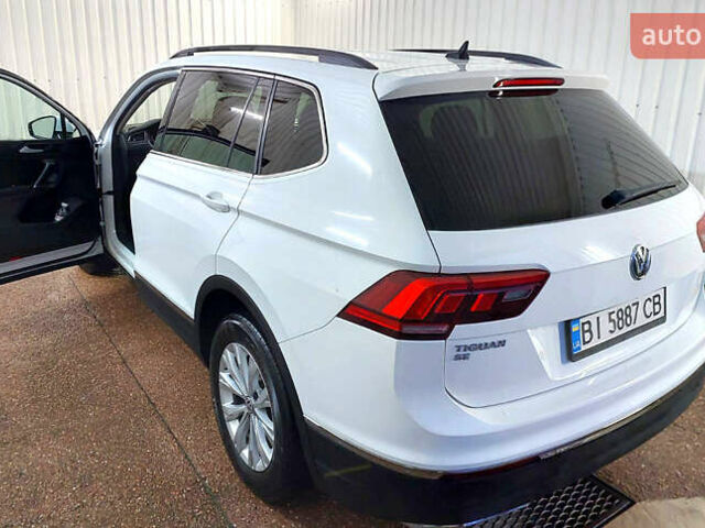 Білий Фольксваген Тігуан, об'ємом двигуна 2 л та пробігом 145 тис. км за 23600 $, фото 64 на Automoto.ua