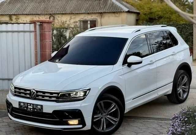 Белый Фольксваген Тигуан, объемом двигателя 2 л и пробегом 90 тыс. км за 18000 $, фото 1 на Automoto.ua