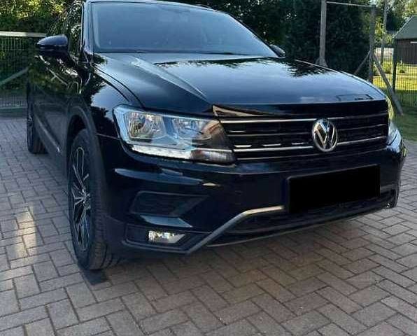 Черный Фольксваген Тигуан, объемом двигателя 2 л и пробегом 98 тыс. км за 15000 $, фото 1 на Automoto.ua