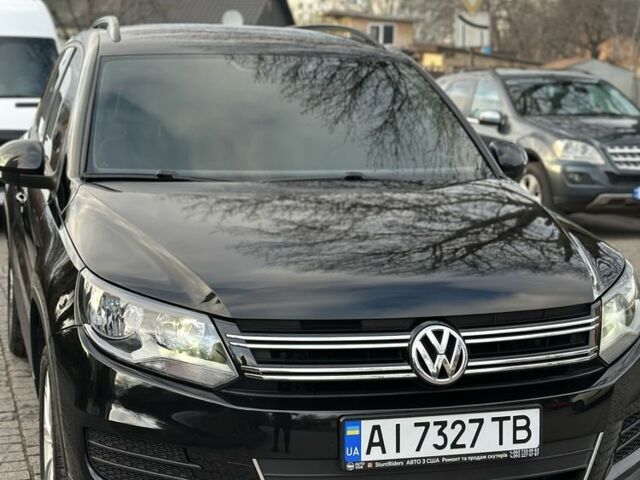 Черный Фольксваген Тигуан, объемом двигателя 2 л и пробегом 107 тыс. км за 13600 $, фото 1 на Automoto.ua