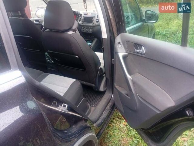 Черный Фольксваген Тигуан, объемом двигателя 1.4 л и пробегом 300 тыс. км за 9300 $, фото 1 на Automoto.ua