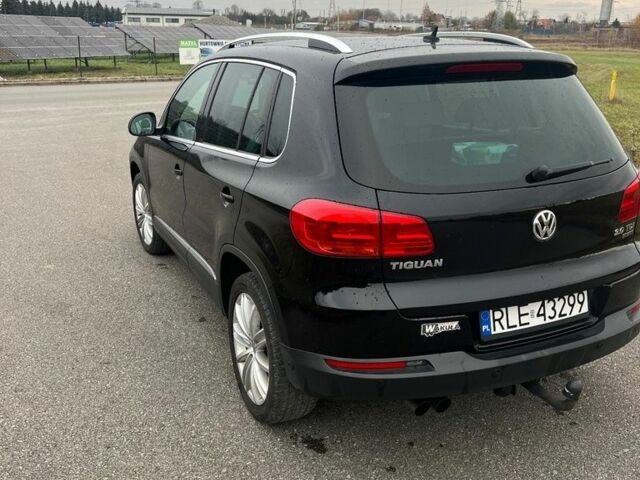 Чорний Фольксваген Тігуан, об'ємом двигуна 2 л та пробігом 160 тис. км за 7800 $, фото 2 на Automoto.ua