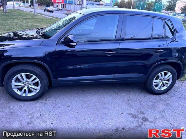Чорний Фольксваген Тігуан, об'ємом двигуна 2 л та пробігом 261 тис. км за 13000 $, фото 1 на Automoto.ua