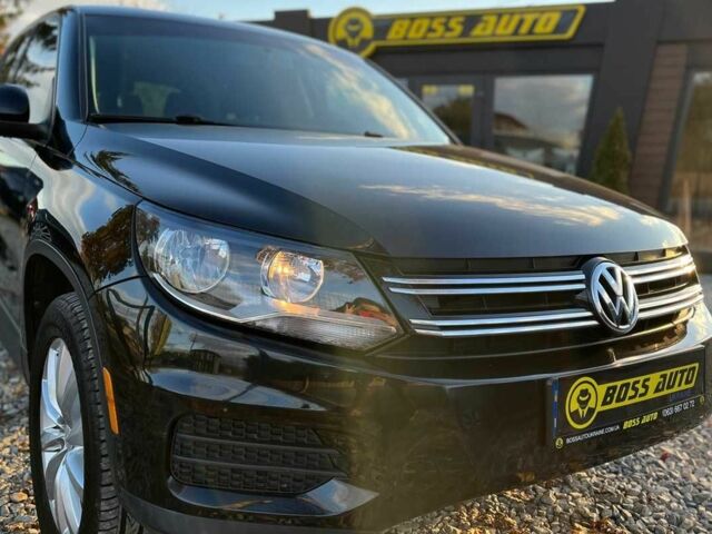 Чорний Фольксваген Тігуан, об'ємом двигуна 2 л та пробігом 200 тис. км за 10999 $, фото 1 на Automoto.ua