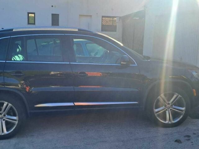 Чорний Фольксваген Тігуан, об'ємом двигуна 2 л та пробігом 231 тис. км за 12000 $, фото 1 на Automoto.ua