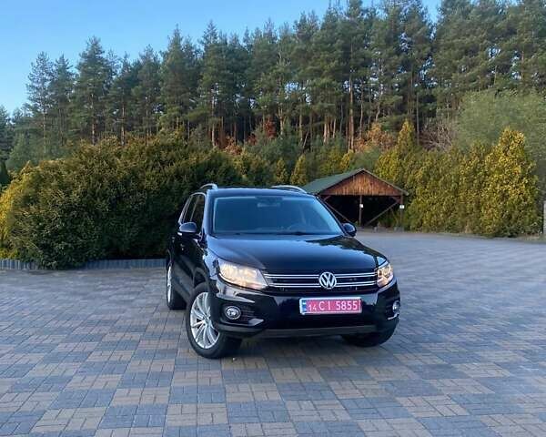 Чорний Фольксваген Тігуан, об'ємом двигуна 1.99 л та пробігом 180 тис. км за 11300 $, фото 1 на Automoto.ua