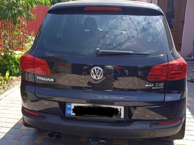 Чорний Фольксваген Тігуан, об'ємом двигуна 2 л та пробігом 200 тис. км за 12700 $, фото 1 на Automoto.ua