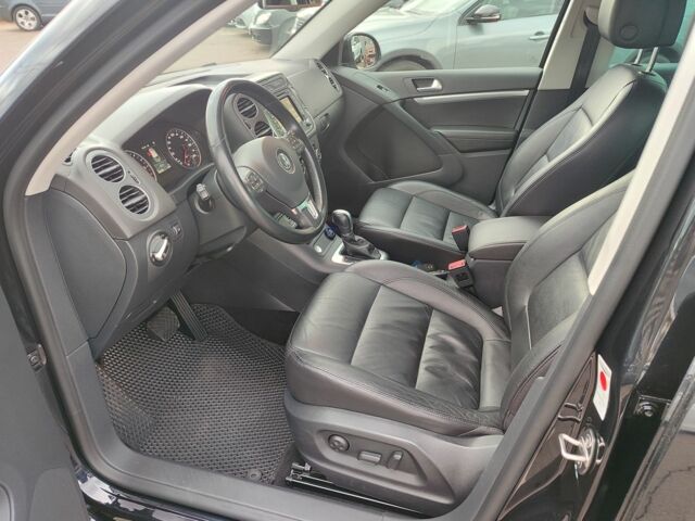 Чорний Фольксваген Тігуан, об'ємом двигуна 2 л та пробігом 150 тис. км за 18799 $, фото 1 на Automoto.ua