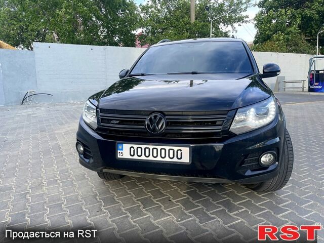 Черный Фольксваген Тигуан, объемом двигателя 2 л и пробегом 246 тыс. км за 9000 $, фото 1 на Automoto.ua