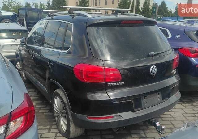 Чорний Фольксваген Тігуан, об'ємом двигуна 2 л та пробігом 210 тис. км за 7800 $, фото 2 на Automoto.ua