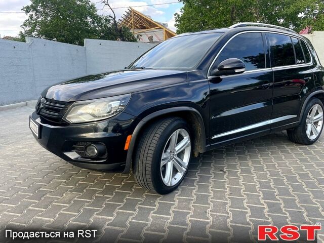 Черный Фольксваген Тигуан, объемом двигателя 2 л и пробегом 246 тыс. км за 9000 $, фото 2 на Automoto.ua