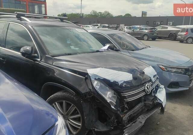 Чорний Фольксваген Тігуан, об'ємом двигуна 2 л та пробігом 210 тис. км за 7800 $, фото 1 на Automoto.ua